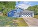 Charming blue house with a two-car garage at 1112 Royal Marquis Cir, Ocoee, FL 34761
