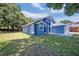 Blue house with white accents and a side yard at 1112 Royal Marquis Cir, Ocoee, FL 34761