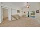 Living room with sliding doors leading to the backyard at 1112 Royal Marquis Cir, Ocoee, FL 34761