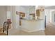 Kitchen with light wood cabinets and a breakfast bar at 1112 Royal Marquis Cir, Ocoee, FL 34761