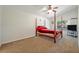 Spacious bedroom with a four-poster bed and ceiling fan at 1112 Royal Marquis Cir, Ocoee, FL 34761
