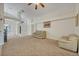 Living room with neutral decor and ample natural light at 1112 Royal Marquis Cir, Ocoee, FL 34761