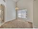 Bright dining room with carpeted floors and a large window at 1112 Royal Marquis Cir, Ocoee, FL 34761