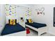 ' bedroom with twin beds and Mickey Mouse themed decor at 4731 Clock Tower Dr # 101, Kissimmee, FL 34746