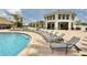Resort-style pool with lounge chairs and a shaded seating area at 4731 Clock Tower Dr # 101, Kissimmee, FL 34746