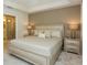 Light and airy Primary bedroom with king-size bed and ensuite bathroom access at 4731 Clock Tower Dr # 101, Kissimmee, FL 34746