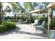 Relaxing shaded seating area with comfortable lounge chairs at 4731 Clock Tower Dr # 101, Kissimmee, FL 34746