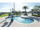 Relaxing resort-style pool with a spa and lift access at 4731 Clock Tower Dr # 101, Kissimmee, FL 34746