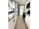 Modern kitchen with white cabinets, granite countertops, and stainless steel appliances at 2015 1/2 Laurel St, Bartow, FL 33830