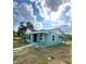 Newly renovated teal home with a well-manicured lawn at 2015 1/2 Laurel St, Bartow, FL 33830