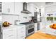 Modern kitchen with stainless steel appliances and marble countertops at 1305 W Lake Mary Blvd, Lake Mary, FL 32746
