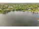 Wide aerial showcasing home's waterfront location at 1305 W Lake Mary Blvd, Lake Mary, FL 32746