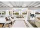 Spacious living room with water views, a piano, and elegant furnishings at 1305 W Lake Mary Blvd, Lake Mary, FL 32746