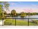Stunning lake view from a private balcony at sunset at 1305 W Lake Mary Blvd, Lake Mary, FL 32746