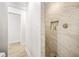 Walk-in shower with marble tile and built-in shelves at 1305 W Lake Mary Blvd, Lake Mary, FL 32746