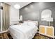 Main bedroom with a king-size bed and gray accent wall at 1305 W Lake Mary Blvd, Lake Mary, FL 32746