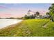 Stunning lakefront home with expansive lawn, offering serene sunset views at 1305 W Lake Mary Blvd, Lake Mary, FL 32746