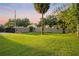 Landscaped backyard with lush lawn and gated entrance at 1305 W Lake Mary Blvd, Lake Mary, FL 32746