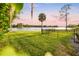 Backyard with lake view, lush grass, and an iron fence at 1305 W Lake Mary Blvd, Lake Mary, FL 32746