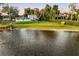 Lakefront property showcasing a home with a spacious yard at 1305 W Lake Mary Blvd, Lake Mary, FL 32746