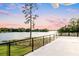 Stunning lake view from a balcony with glass railings at 1305 W Lake Mary Blvd, Lake Mary, FL 32746