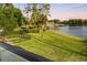 Elevated balcony showcases tranquil lake view and lush greenery at 1305 W Lake Mary Blvd, Lake Mary, FL 32746
