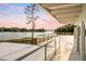 Spacious balcony boasting serene lake views and sunset colors at 1305 W Lake Mary Blvd, Lake Mary, FL 32746