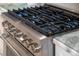 Close-up of a stainless steel gas cooktop with multiple burners at 1305 W Lake Mary Blvd, Lake Mary, FL 32746