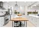 Modern kitchen with a large island and stainless steel appliances at 1305 W Lake Mary Blvd, Lake Mary, FL 32746