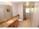Clean bathroom with granite vanity and striped shower curtain at 1201 Thornbury Ct, Winter Garden, FL 34787