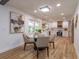Bright dining area with glass table and chairs near kitchen and windows at 965 Tuskawilla Rd, Winter Springs, FL 32708