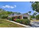 Charming brick home with a two-car garage and lush landscaping at 965 Tuskawilla Rd, Winter Springs, FL 32708
