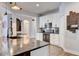 Modern kitchen with white cabinets, granite countertops and breakfast bar at 2938 Daybreak Dr, Orlando, FL 32825