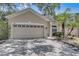 Two-car garage home with a nicely landscaped yard at 2938 Daybreak Dr, Orlando, FL 32825