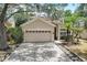 Two-story house with a two-car garage and paver driveway at 2938 Daybreak Dr, Orlando, FL 32825
