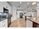 Updated kitchen with white cabinets, granite countertops and stainless steel appliances at 2938 Daybreak Dr, Orlando, FL 32825