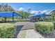 Community playground with shaded play structures and swings at 2938 Daybreak Dr, Orlando, FL 32825