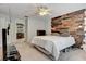 Main bedroom with wood feature wall and en-suite bathroom at 2938 Daybreak Dr, Orlando, FL 32825