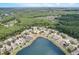 Community view with houses, lake and conservation at 2938 Daybreak Dr, Orlando, FL 32825