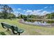 Serene lake view with a park bench at 2938 Daybreak Dr, Orlando, FL 32825