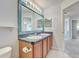 Updated bathroom with double vanity and a large mirror at 2938 Daybreak Dr, Orlando, FL 32825