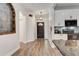Light and bright entryway with dark hardwood floors and kitchen view at 2938 Daybreak Dr, Orlando, FL 32825