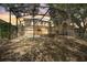 Backyard view of screened-in pool and spa at sunset at 2938 Daybreak Dr, Orlando, FL 32825