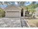 Two-car garage home with a nicely landscaped yard at 2938 Daybreak Dr, Orlando, FL 32825