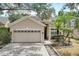 Two-story house with a two-car garage and paver driveway at 2938 Daybreak Dr, Orlando, FL 32825