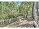 Landscaped backyard with white picket fence at 2938 Daybreak Dr, Orlando, FL 32825