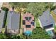 An aerial view showcasing a house with a pool and solar panels at 2938 Daybreak Dr, Orlando, FL 32825