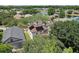 Aerial view of homes with solar panels and a tranquil lake nearby at 2938 Daybreak Dr, Orlando, FL 32825