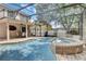 Screened-in pool with spa and patio furniture at 2938 Daybreak Dr, Orlando, FL 32825