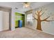 Cozy bedroom with tree mural, ceiling fan and closet at 2938 Daybreak Dr, Orlando, FL 32825